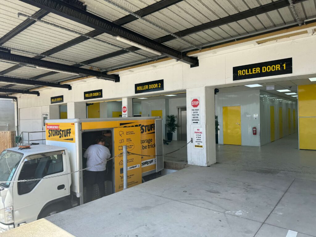 Open doors at the Wellington storage facility, symbolizing a warm welcome and readiness to serve customers.